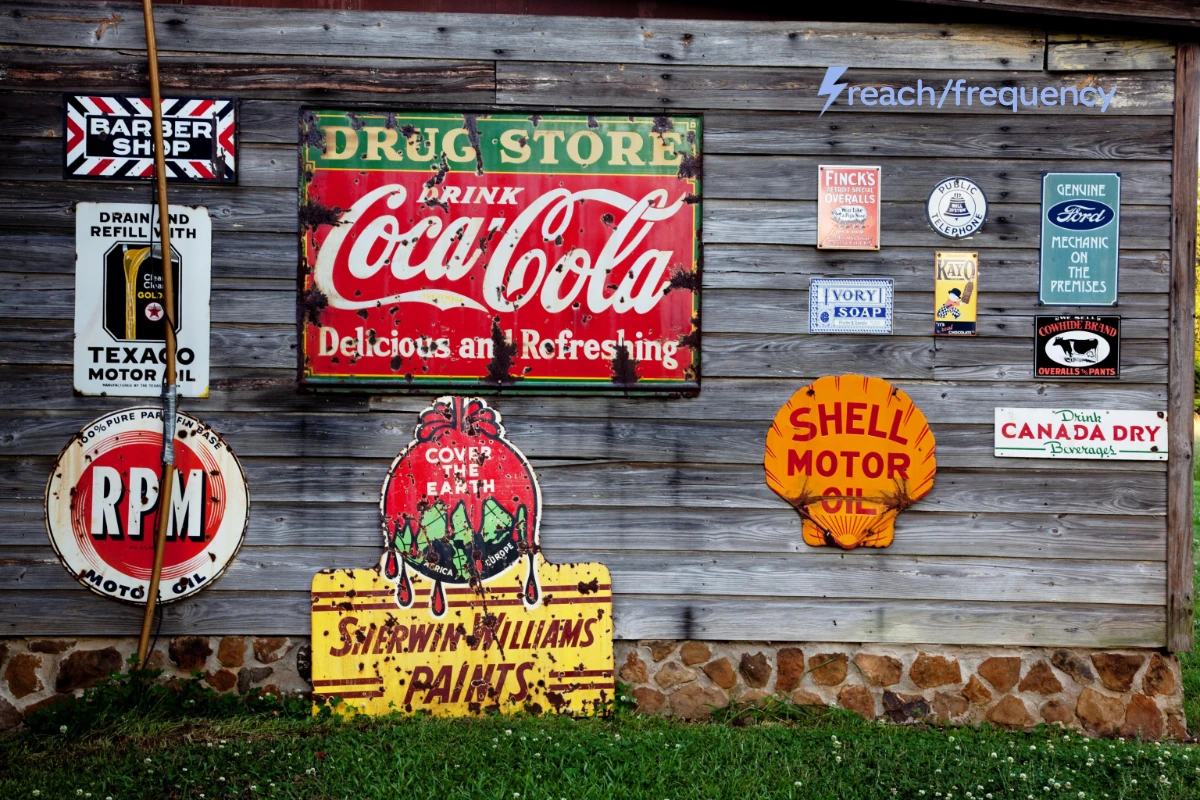 vintage advertising signs on a barn wall